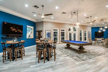Fountain Villas Social Lounge with Billiards and Tables with chairs